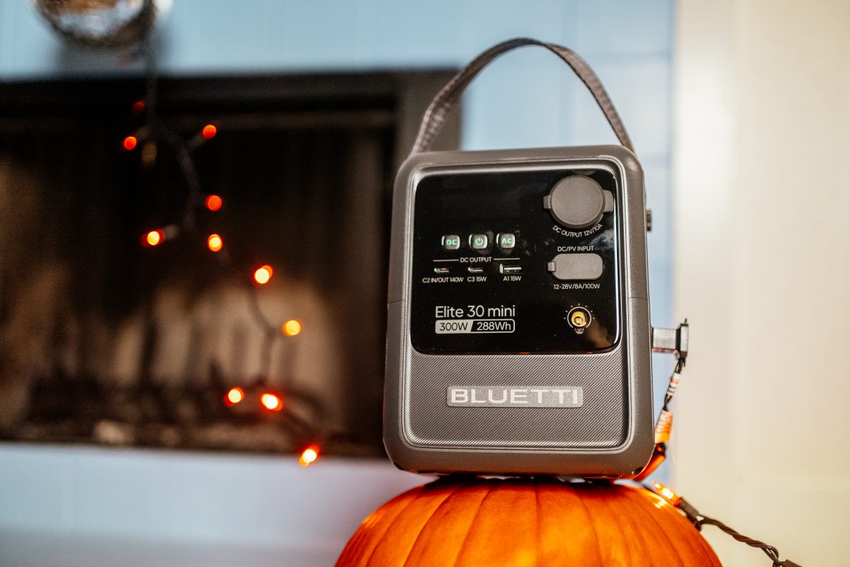 Bluetti Elite 30 Mini with its carry handle, powering string lights at home